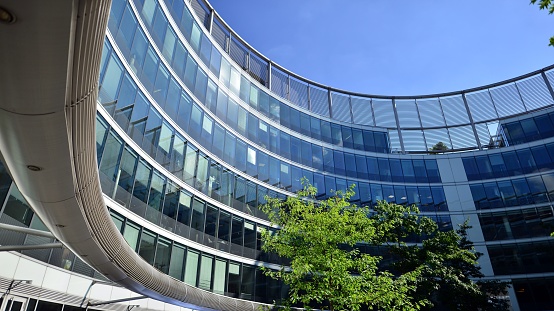 Low angle view of the glass facade of an office building.